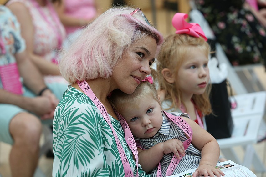 Savannah and Luna Holds watch Anthony Holds speak.