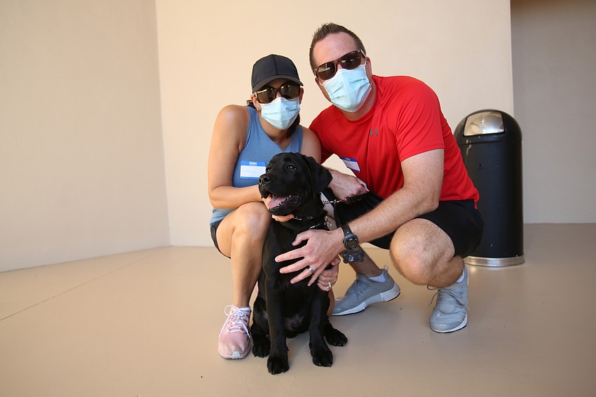 Sheena and Steven Lambright brings their dog Nolan to the temple.