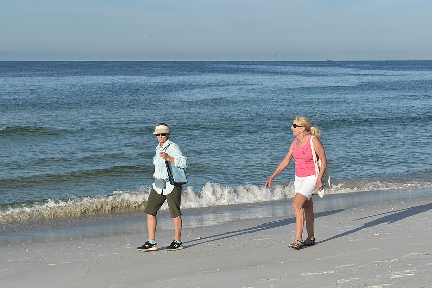 Carol Jensen and Suzy Mitchell kept an eye out for trash as the water's edge.