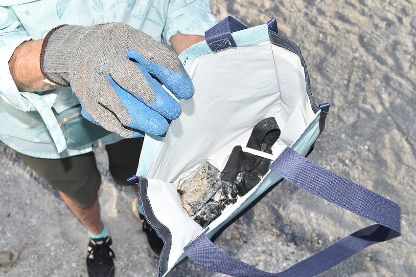 Carol Jensen filled a small bag about halfway with trash.