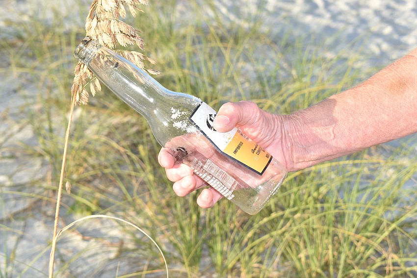 Suzy Mitchell found a beer bottle hidden in the dunes.