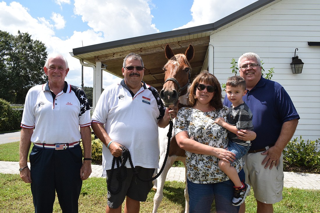 Elks Bob Erwin, Darrin Simone and Dan Tabor support Hooves with H.E.A.R.T. President Danielle Curtis and rider Frankie Pizzurro with their donations.