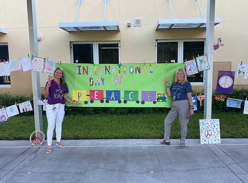 Ashley Terry, the assistant principal, and Cheryl McGrew, the principal, celebrate Peace Day with their students and staff. Courtesy photo.