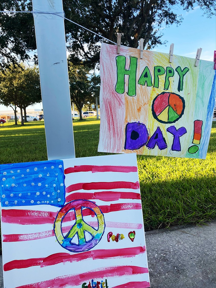 Students' artwork showing what peace means to them hangs outside the school. Courtesy photo.