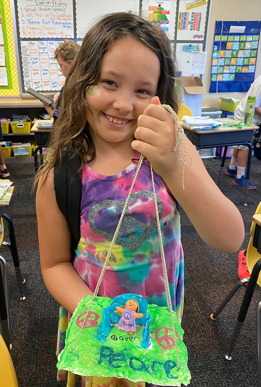 Fourth grader Sandra Vidanova presents her clay peace project. Courtesy photo.