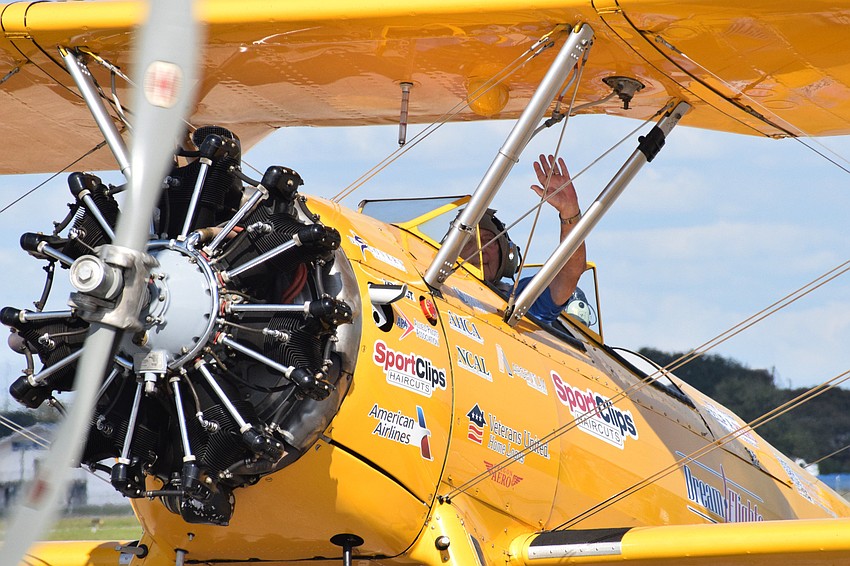 Joe Abrams, who is a Cypress Springs Gracious Retirement Living resident and Korean War veteran, waves goodbye as he takes off for his flight.
