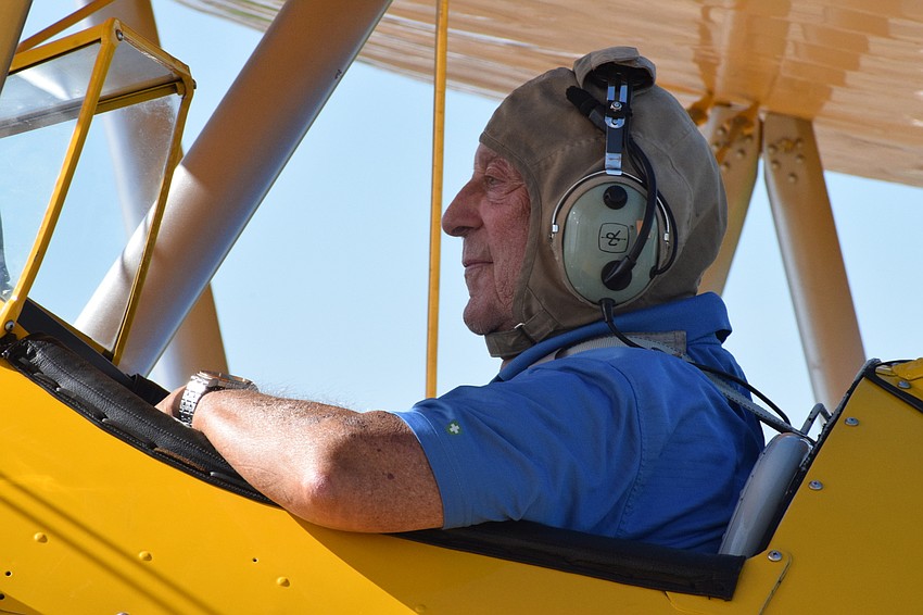 Joe Abrams, who's a Cypress Springs Gracious Retirement Living resident and Korean War veteran, relaxes in the cockpit before he takes off in the Spirit of Wisconsin.