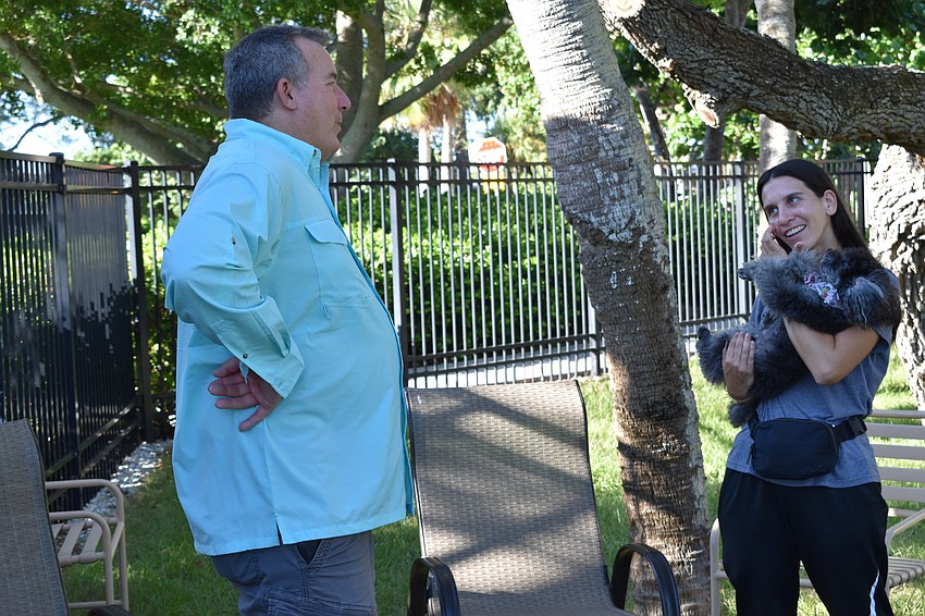 Peter Larson and Fannie Bushin chat on Friday morning at Bayfront Park's dog park.