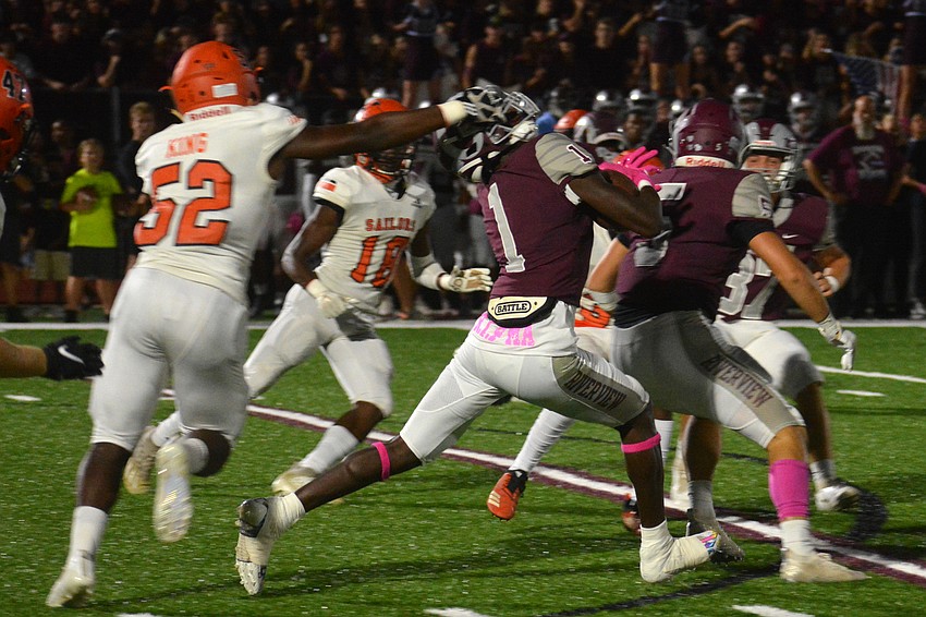Sarasota linebacker Jacquez King grabs the facemask of Riverview's Charles Lester Jr. on the game's opening kick return. King was called for a penalty.