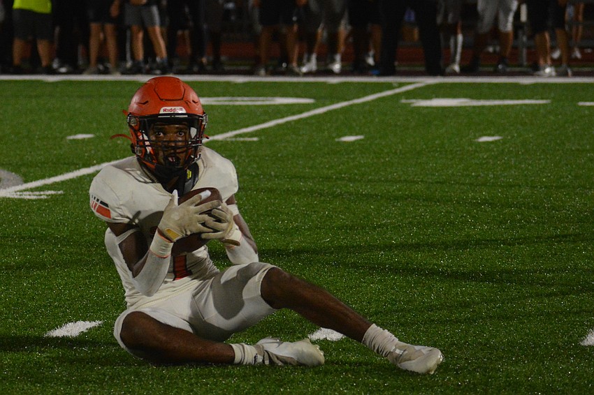 Sarasota wide receiver Tyler Pack comes up with a tough catch.