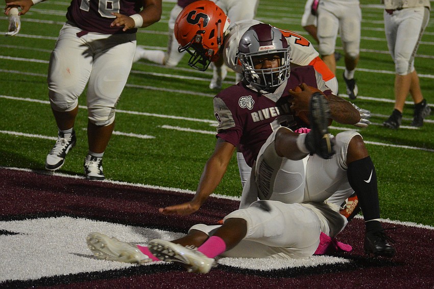 Riverview running back Jay'den Birch rolls over a defender into the end zone.