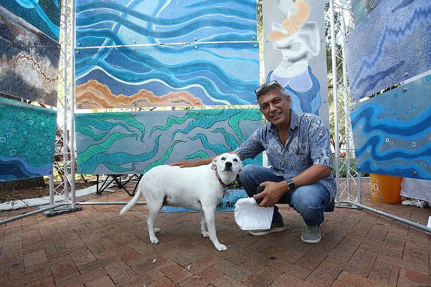 Sanjib Mallik of Infinite Fine Arts sells translucent acrylic designs with his dog, Daisy.