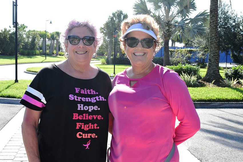 Sisters Beth Ward and Faye Weissbaum continue on their walk.