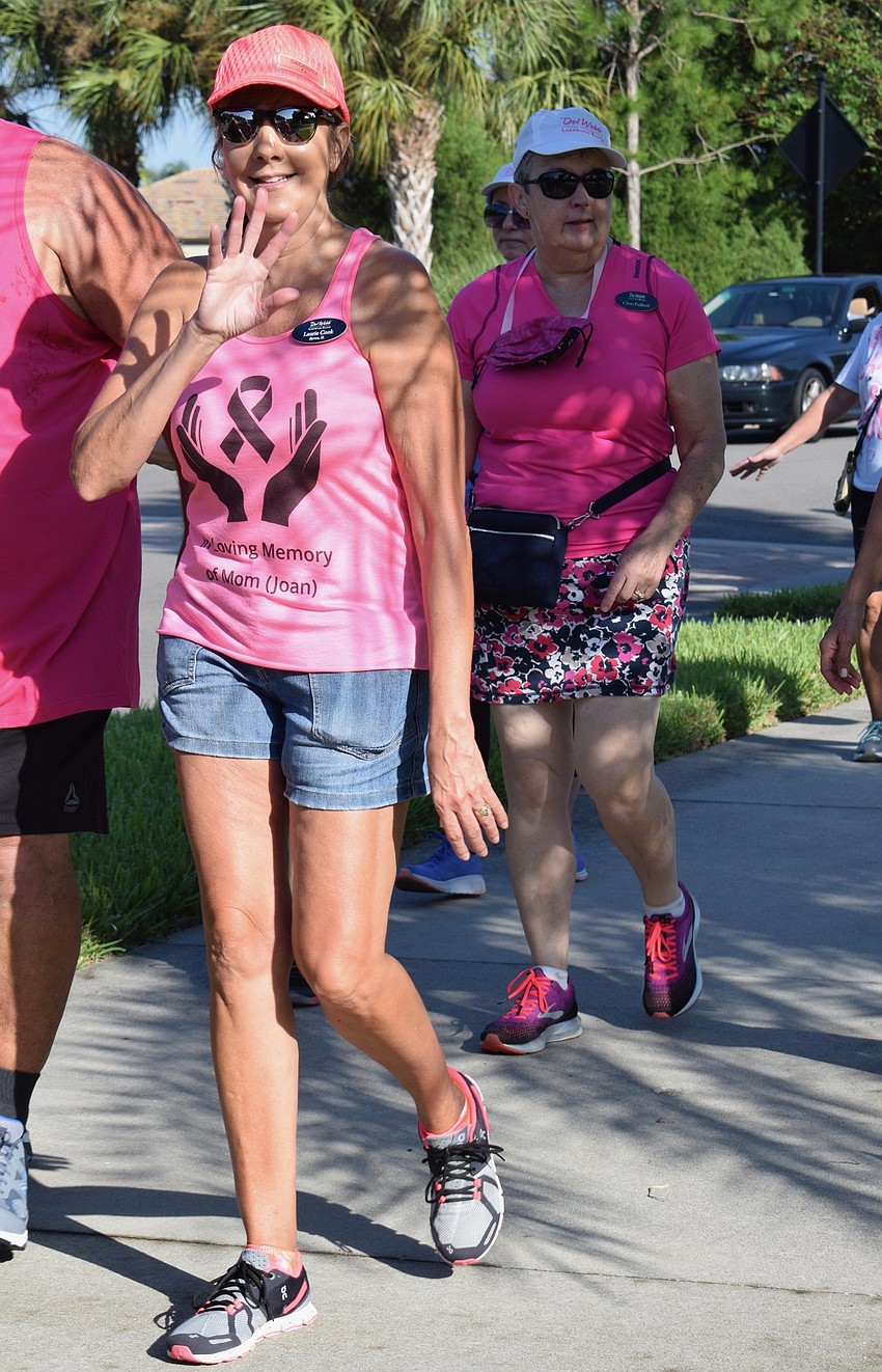 Del Webb's Laurie Cook and Chris Fulford enjoy walking in the walkathon.