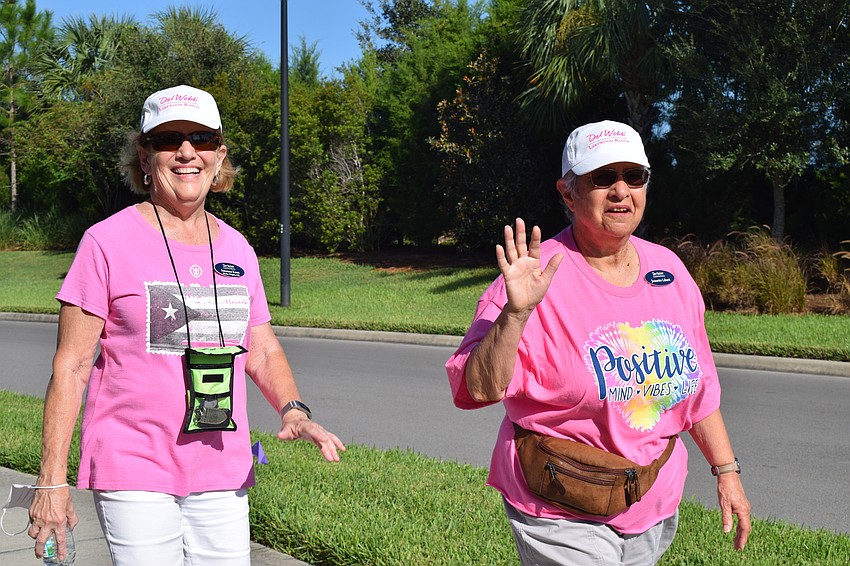 Del Webb's Suzanne Keen and Jeanette Libert walk together.