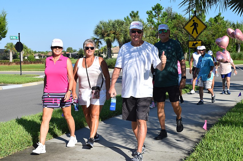 Del Webb's Mary Noon, Diane Elwood, Jeff Elwood and Ernie Finn start the walkathon.