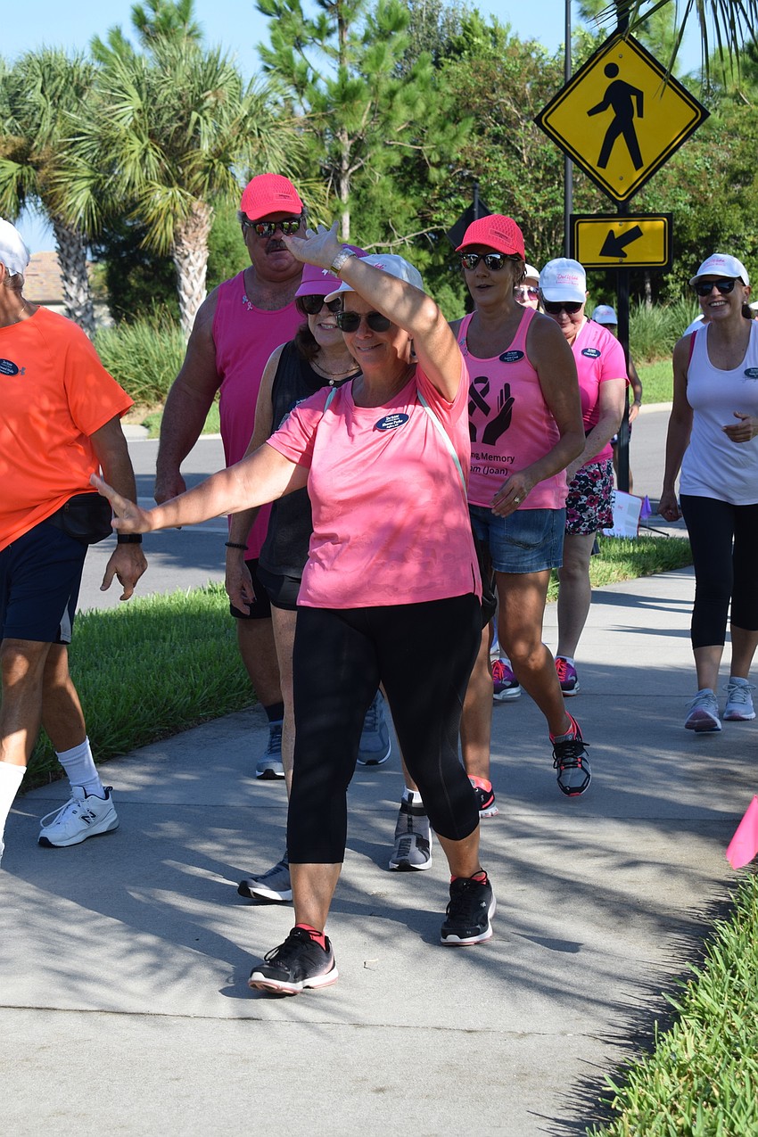 Del Webb's Sheree Parke dances as she begins the walkathon.