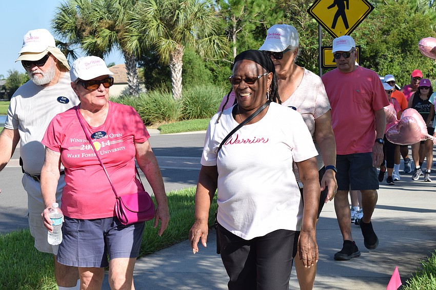 Del Webb residents Laurie Hoppe and Carolyn Weinstock start walking in the walkathon.
