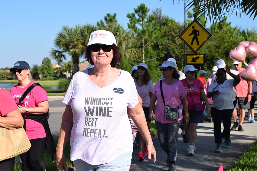 Del Webb's Marilyn Niedzwiecki begins the walkathon.