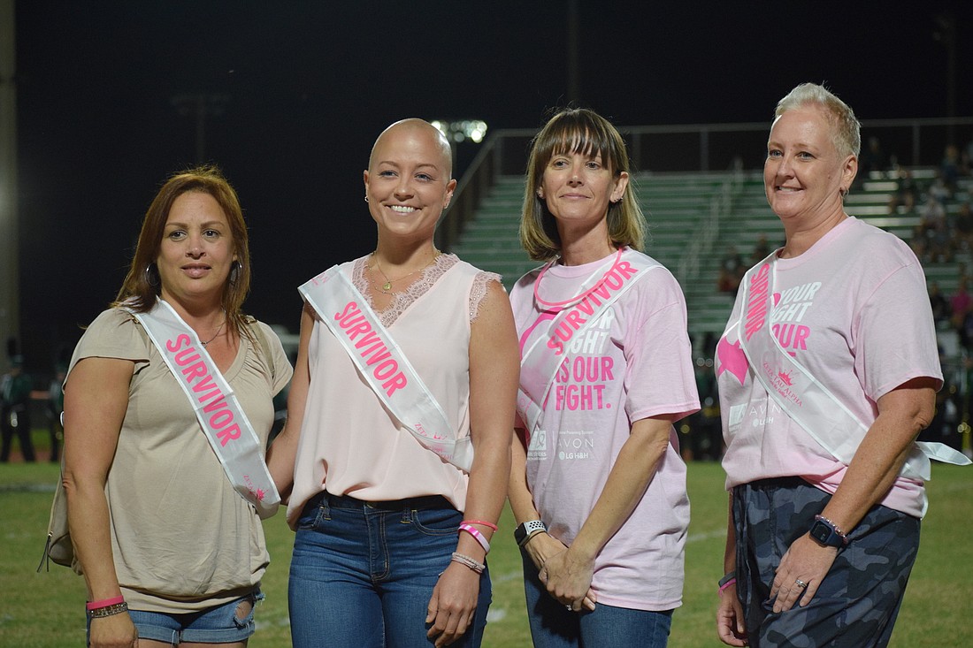 Lakewood Ranch&#39;s Giselle Ucciferri, Bradenton&#39;s Megan Yost, east Bradenton&#39;s Corina Geiger and Summerfield&#39;s Betsy Young are honored during the half time of Lakewood Ranch High School&#39;s pink out football game.
