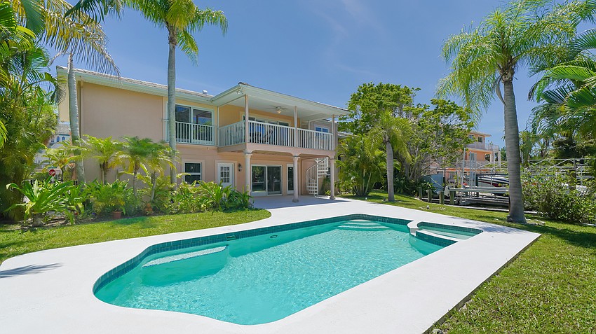 The back yard swimming pool overlooks the canal.