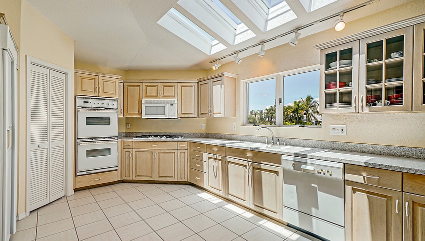 Skylights fill the kitchen area with natural brightness.