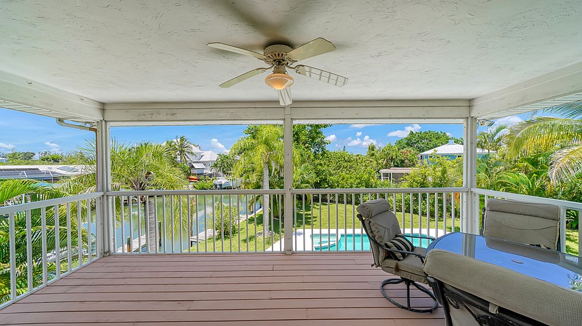 The half-acre lot offers 100 feet of canal frontage.