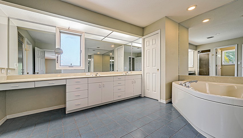 The master suite is set off from the other living spaces.