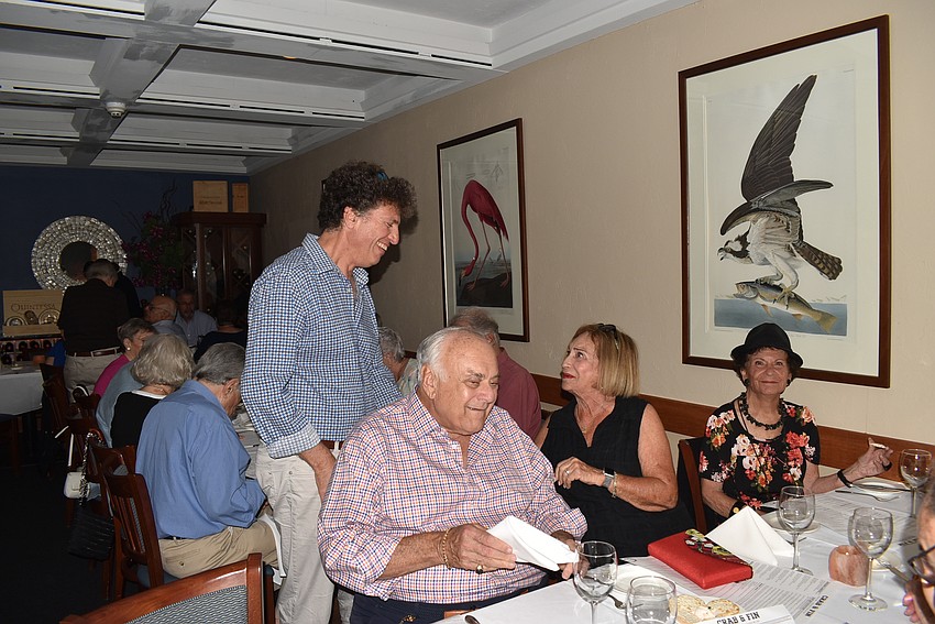 Attendees made the rounds and said hello to friends before finding their seats.