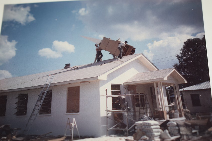 Workers put the steeple on the church in 1967.