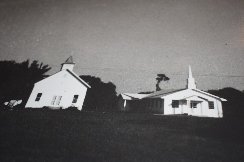 The original church, on the left, was held up by cables after being damaged by Hurricane Donna. The new church, to the right, opened in 1967.
