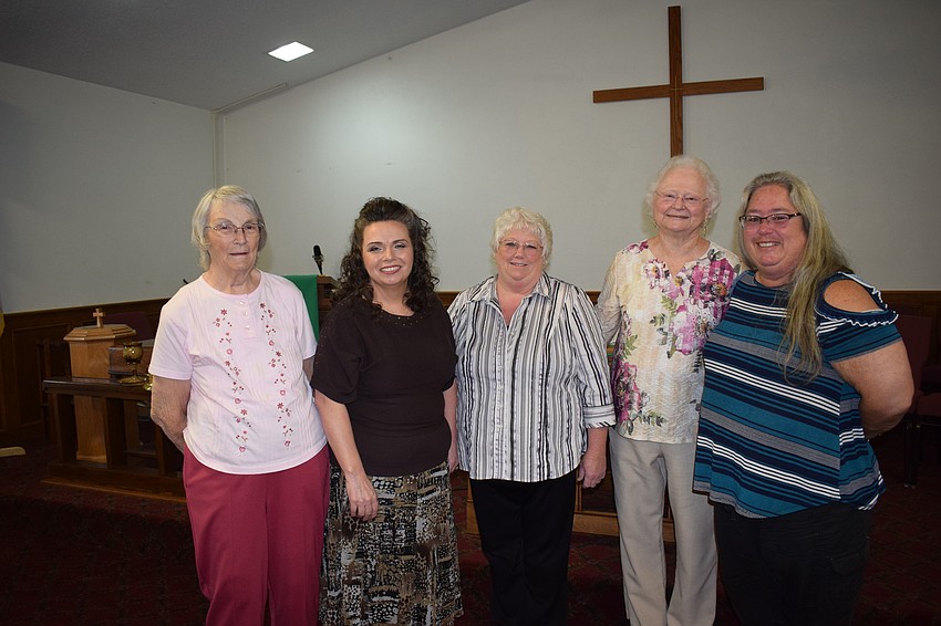 Sue Stoliker, Lisa Dawn, Nancy Ness, Marilyn Coker and Yvonne Colegrove say the parishioners feel like they are part of a family.
