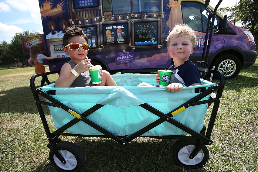 Jake De Leo and Dax Fuller enjoy frozen treats.