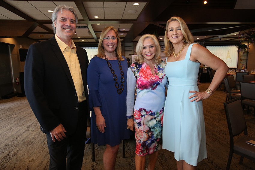 Rob Robiniecki and Jennifer Rominiecki with Margaret Wise and event co-chair Pauline Wamsler