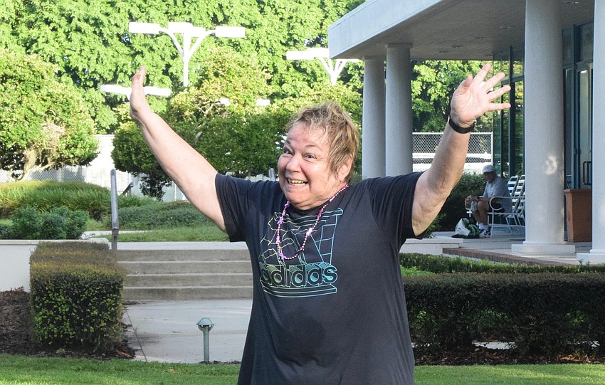 Ellen Rothbaum celebrates her win in musical squats. Just like musical chairs, participants ran around in a circle until the music stopped. They had to find a mat to do a squat on and whoever couldn't find a mat was out.