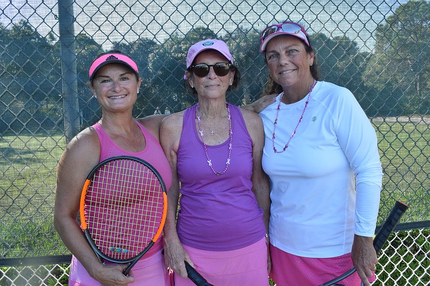 Kelly Reeve, Rose Waag and Debbie Dietz try to earn points in the tennis skills challenge.