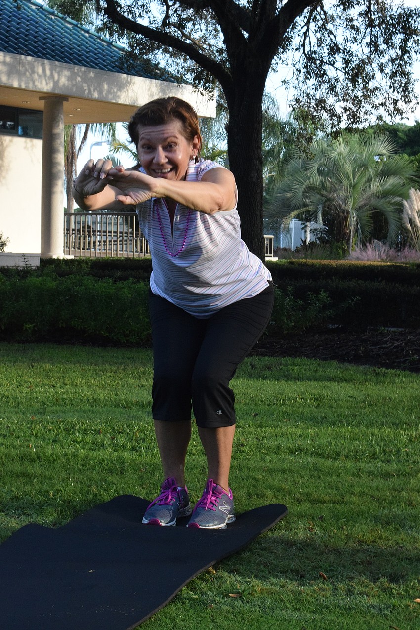 Daniela Soiman squats after securing a mat during musical squats.
