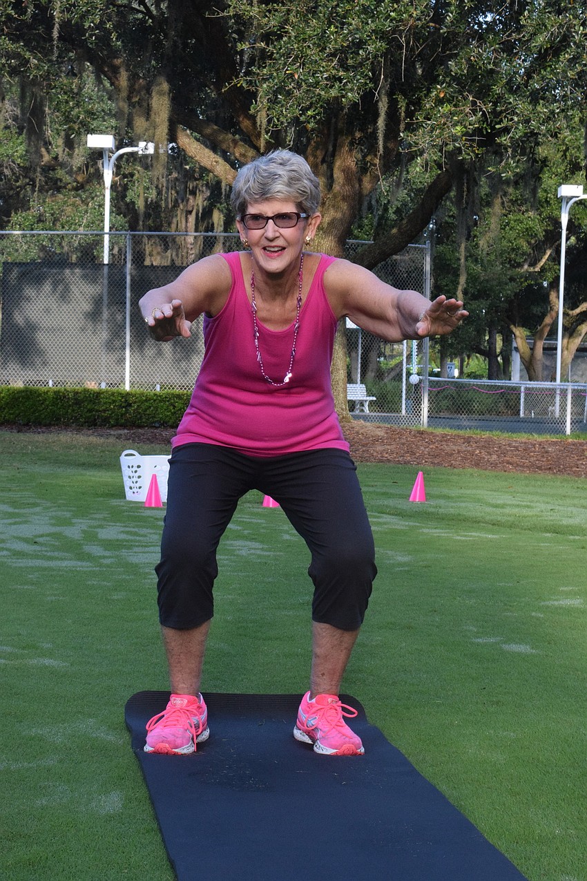 Dale Otterman squats during musical squats, securing her place in the next round.