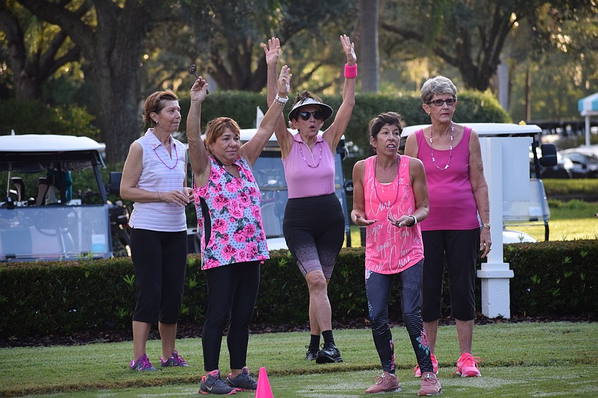 Daniela Soiman, Pam Glazer, Carol Shabe, Gwen Murphy and Lynne Richbourg celebrate a win in the water balloon spoon power walk relay.