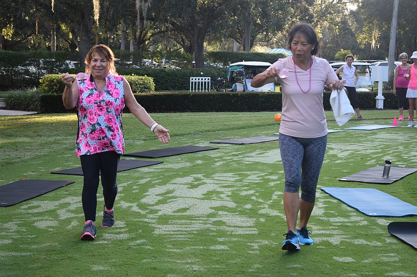 Pam Glazer and Sheila Colletta are careful not to drop their water balloons.