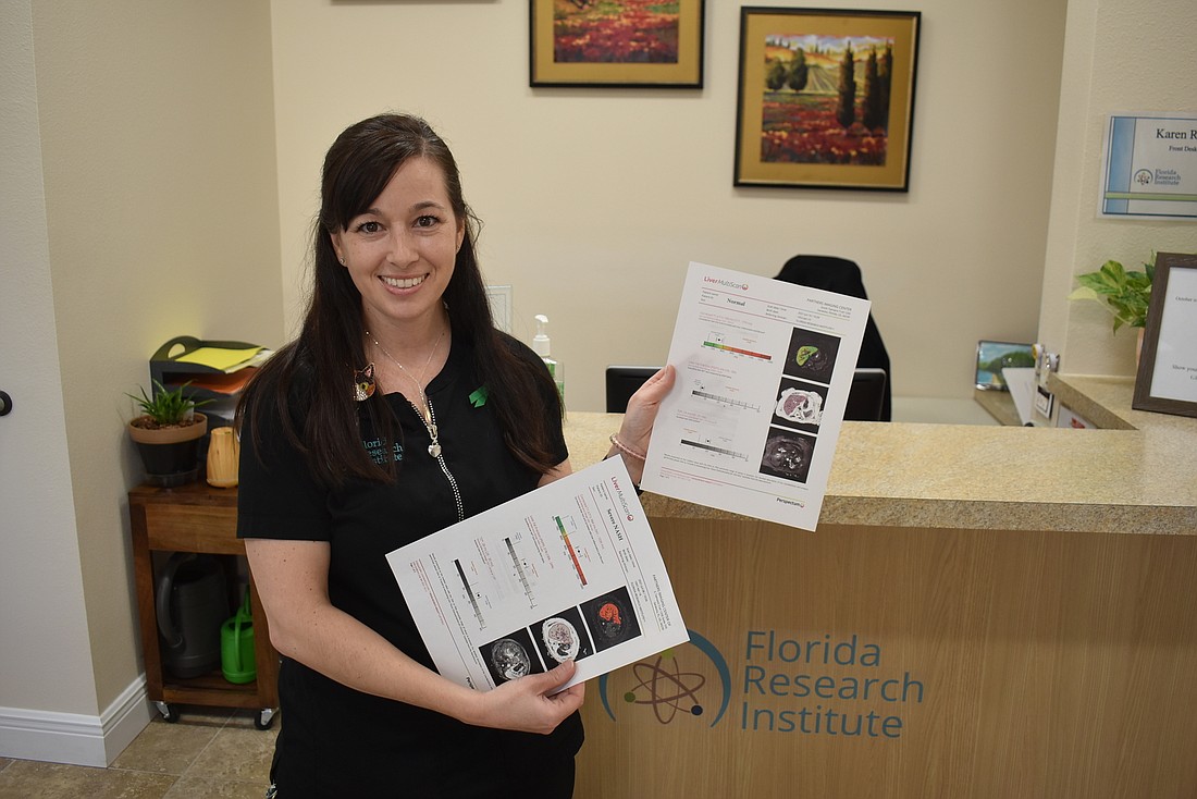 Florida Research Institute Director of Business Development Terese Aragona shows a sample of results of a LiverMultiScan test. The Lakewood Ranch-based institute is offering 200 of the exams free for Type 2 Diabetes patients.