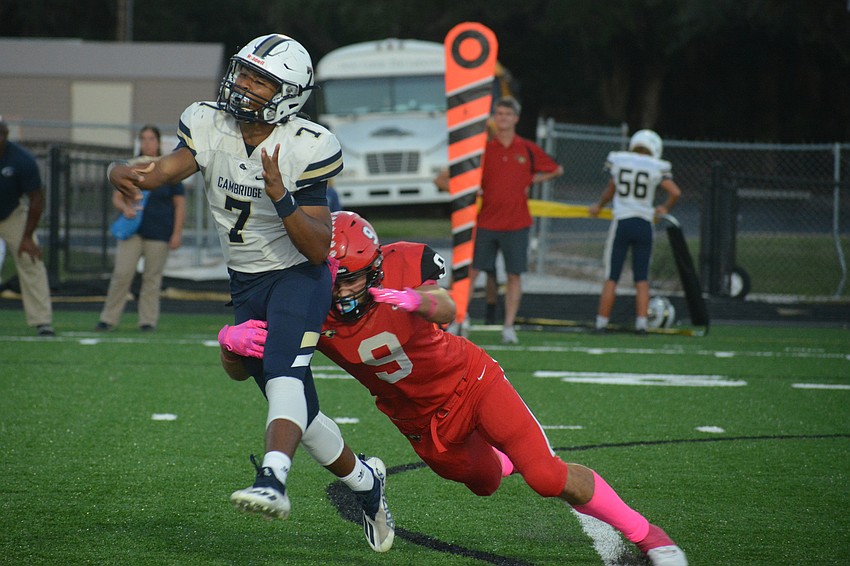 Mooney junior Jack Mackinnon forces a bad throw from Cambridge Christian quarterback Chris Stephenson.