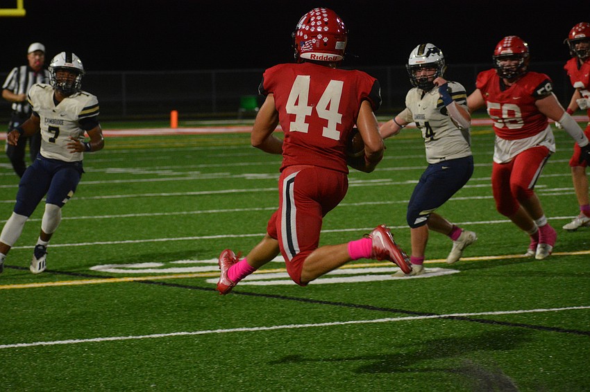 Mooney junior JR Rosenberg leaps after intercepting a pass.