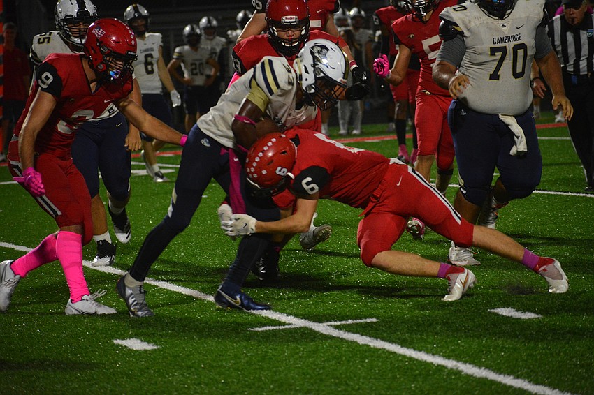 Mooney sophomore Jacob Brown makes a tackle.