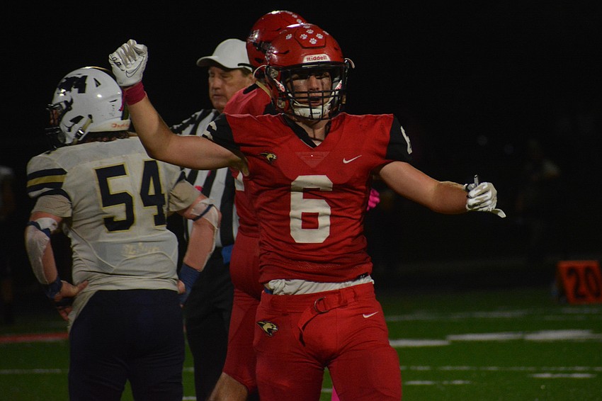 Sophomore Jacob Brown celebrates a Mooney stop on fourth down.