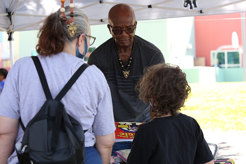 Chip Nelson sells gifts to attendees.