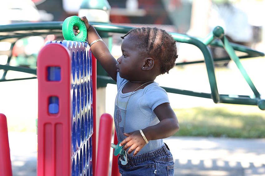 Raielle Wilson plays a stacking game.