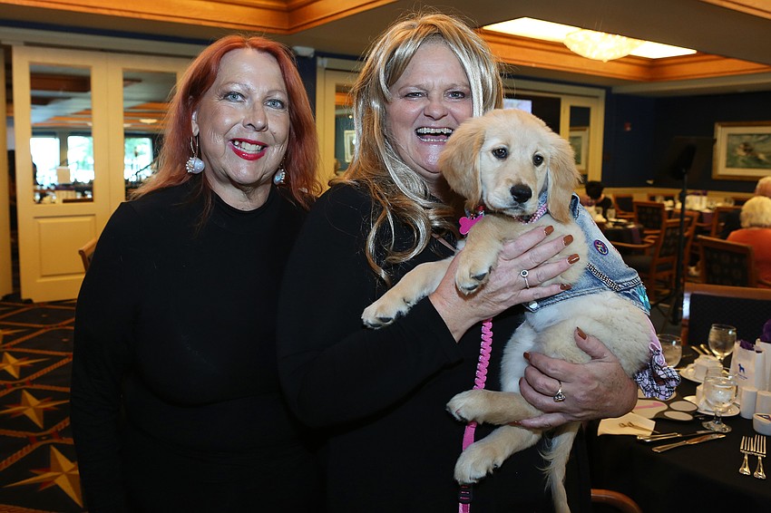 Pam Hagan and Lynne Koons with Dolly Parton the dog