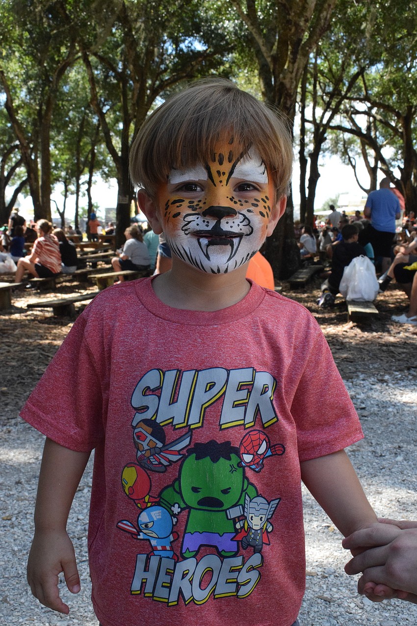 East County's Ethan Scragg, who is 3 years old, has his face painted like a tiger.