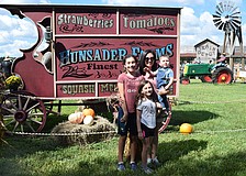 Going to the Pumpkin Festival is a tradition for Myakka City 12-year-old Collette Armstrong, 8-year-old Jeanette Armstrong, Cristina Rosas and 21-month-old Lincoln Armstrong.